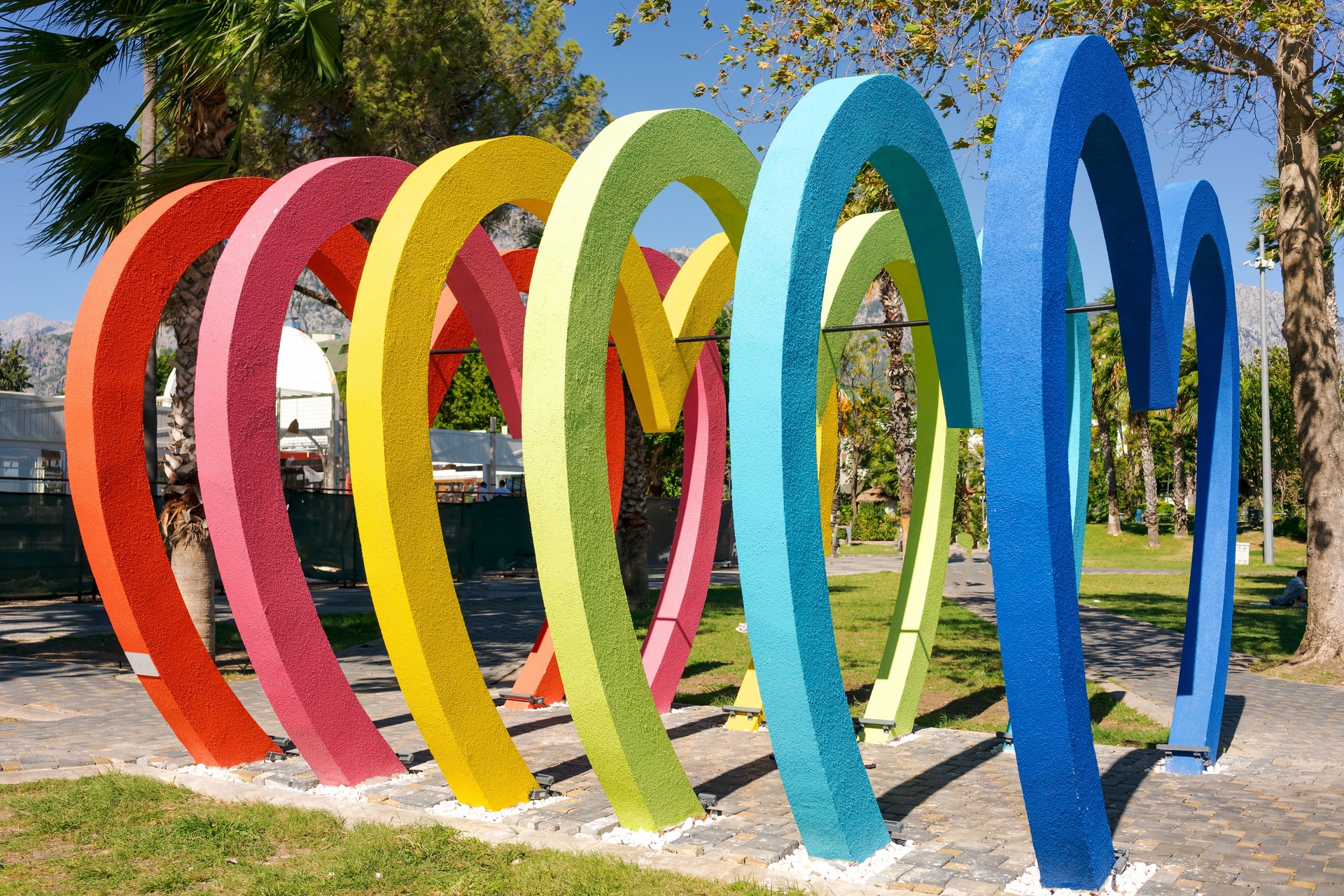 Colorful arches sculpture in the park on a sunny day.